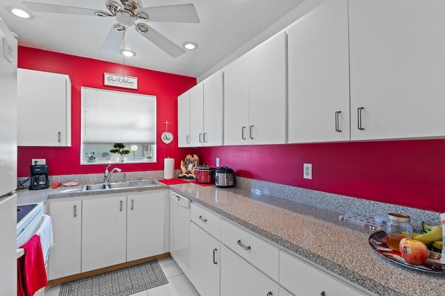 kitchen featuring white appliances, white cabinets, sink, ceiling fan, and light tile patterned floors