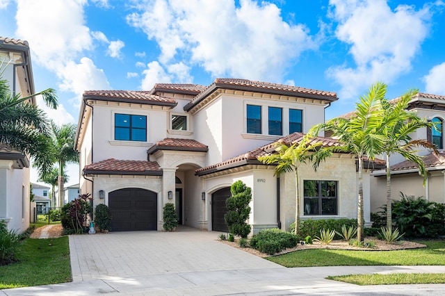 mediterranean / spanish-style house featuring a garage