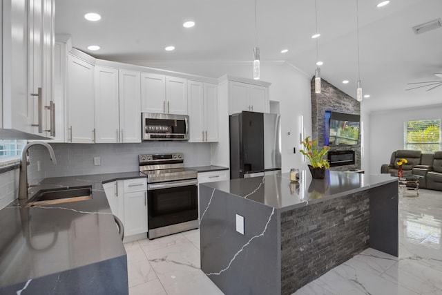 kitchen featuring visible vents, dark countertops, appliances with stainless steel finishes, marble finish floor, and a sink