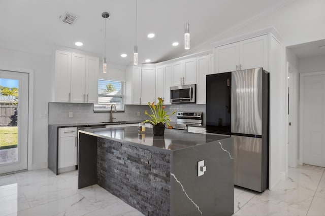 kitchen with stainless steel appliances, a sink, visible vents, marble finish floor, and tasteful backsplash