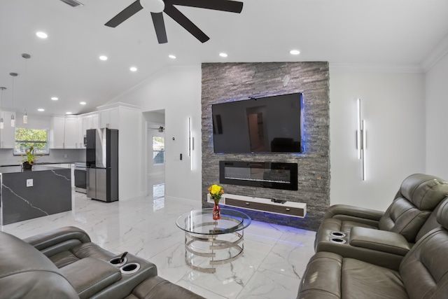 living area featuring marble finish floor, ceiling fan, ornamental molding, and baseboards