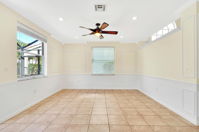 unfurnished room with light tile patterned floors and ceiling fan