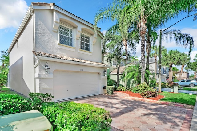 view of front of property with a garage