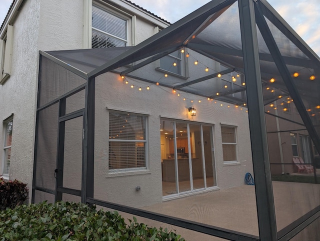 view of yard featuring a patio area and a lanai