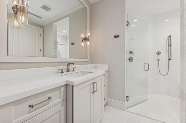 bathroom with vanity, tile patterned floors, walk in shower, and ornamental molding