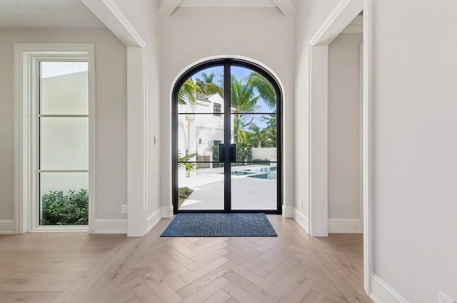 doorway to outside featuring light parquet floors