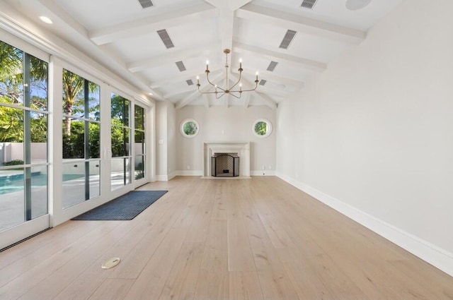 unfurnished living room with vaulted ceiling with beams, light wood-type flooring, and a notable chandelier