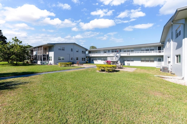 view of yard with central air condition unit