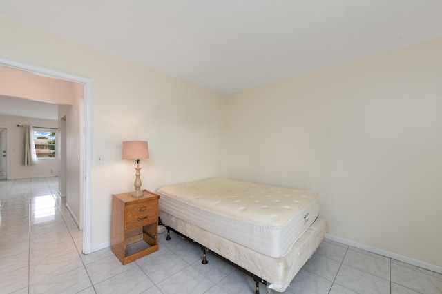 bedroom with light tile patterned flooring