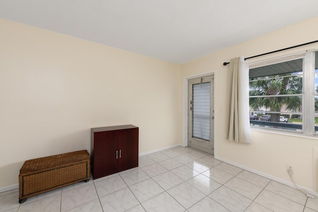 empty room featuring light tile patterned floors