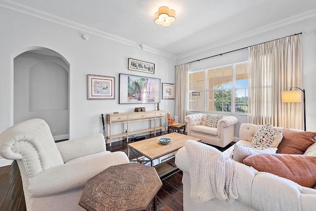 living room with a textured ceiling, dark hardwood / wood-style floors, and crown molding