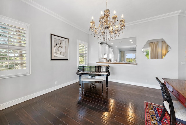 dining room with ornamental molding, dark wood-type flooring, and a chandelier