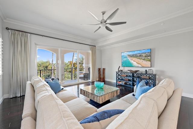 living room with ceiling fan, dark hardwood / wood-style flooring, and ornamental molding