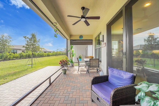 view of patio with ceiling fan