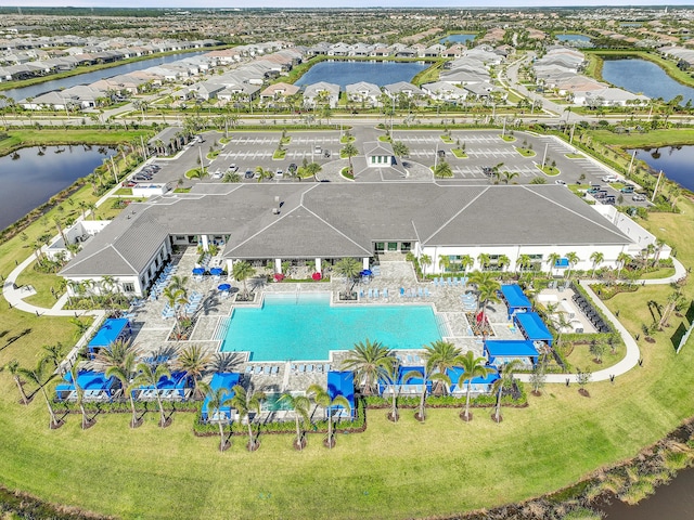 birds eye view of property featuring a water view