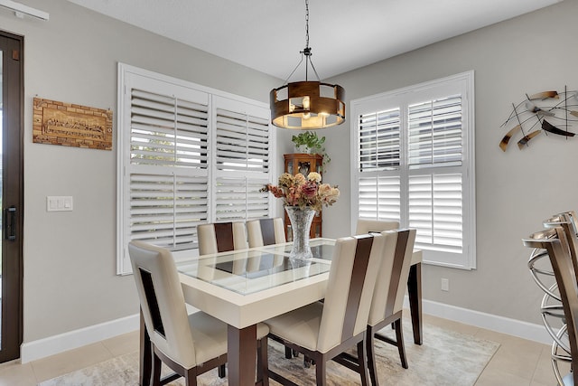 dining area featuring light tile patterned floors