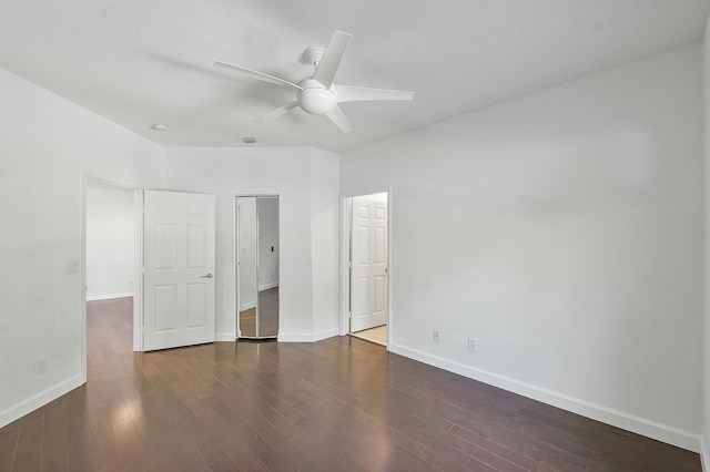 unfurnished bedroom with ceiling fan and dark hardwood / wood-style flooring