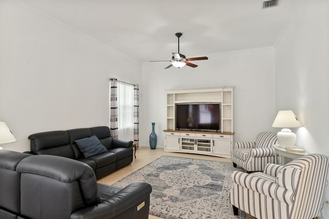 living room with ceiling fan, light tile patterned floors, and crown molding