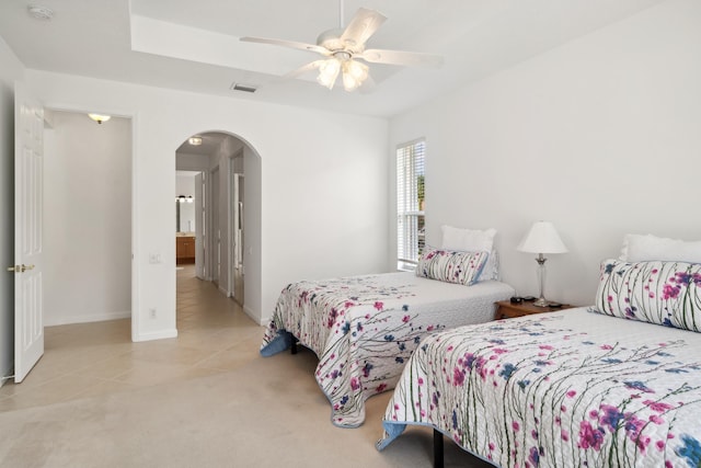 bedroom with ceiling fan and light tile patterned flooring