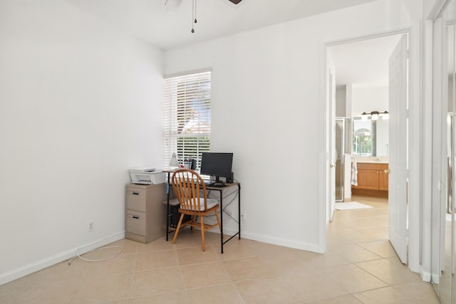 office space featuring ceiling fan and light tile patterned flooring