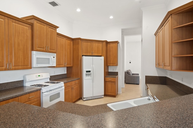 kitchen with sink, white appliances, and ornamental molding