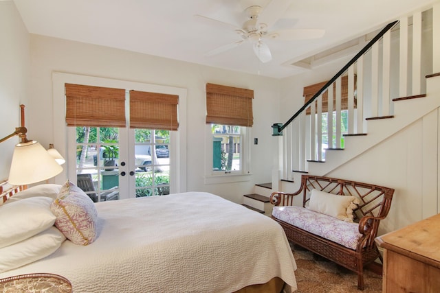 bedroom with access to exterior, ceiling fan, and french doors