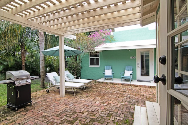 view of patio featuring a pergola and grilling area