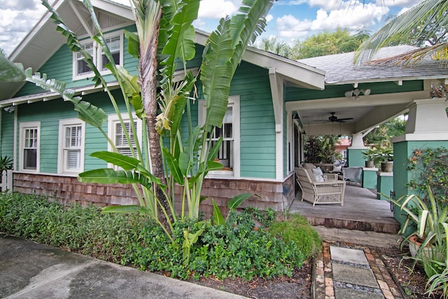 exterior space featuring ceiling fan and a porch