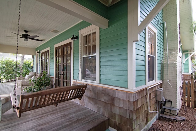 wooden deck featuring ceiling fan and covered porch