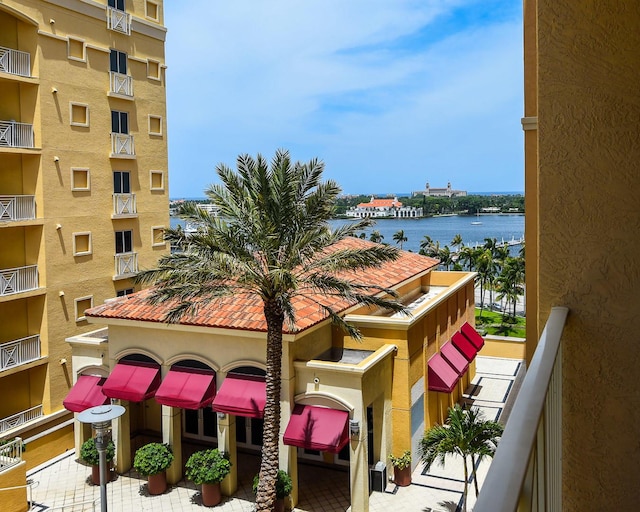 balcony featuring a water view