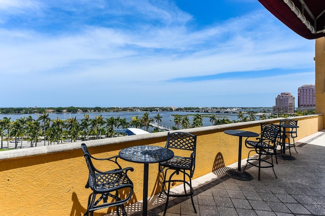 balcony featuring a water view