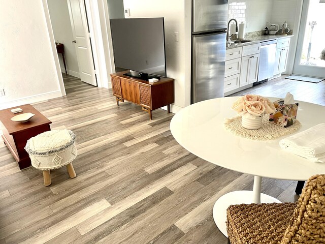 interior space featuring light hardwood / wood-style floors and sink