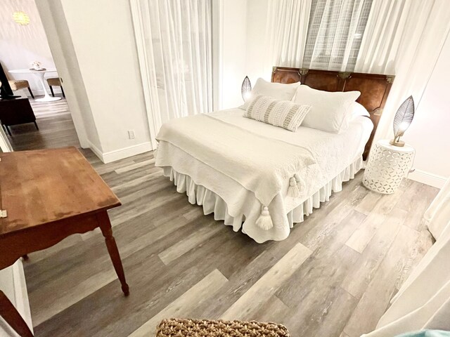 bedroom with hardwood / wood-style flooring