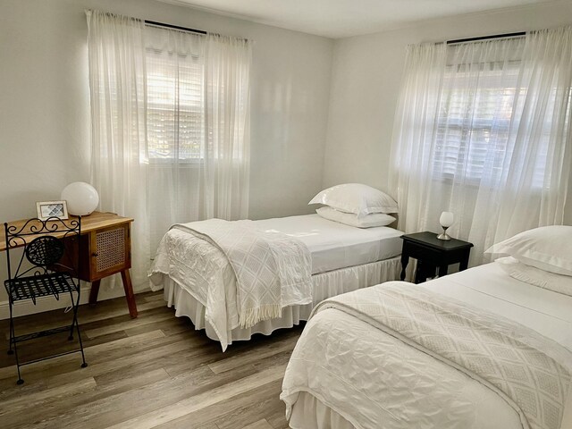 bedroom with hardwood / wood-style floors