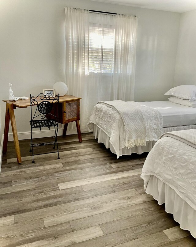 bedroom featuring wood-type flooring