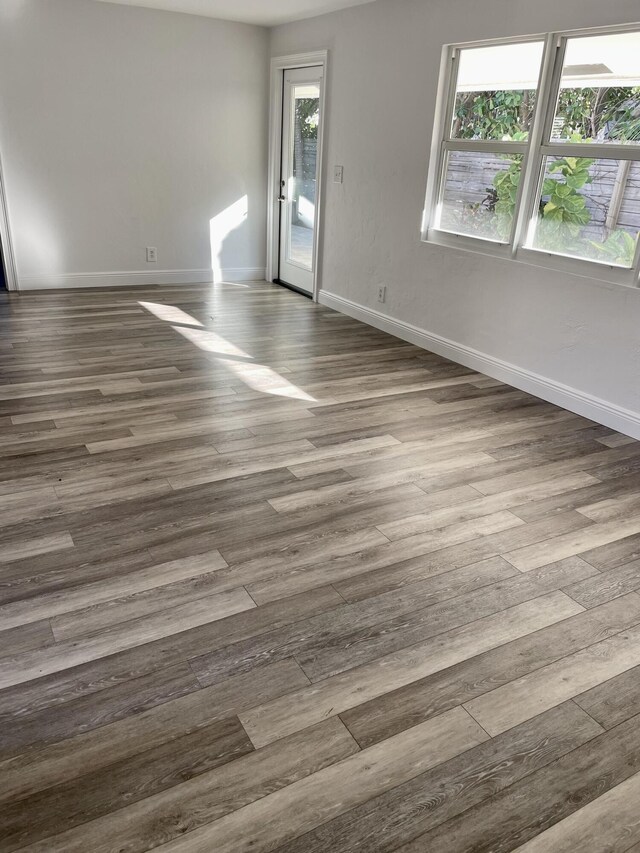 spare room featuring hardwood / wood-style flooring