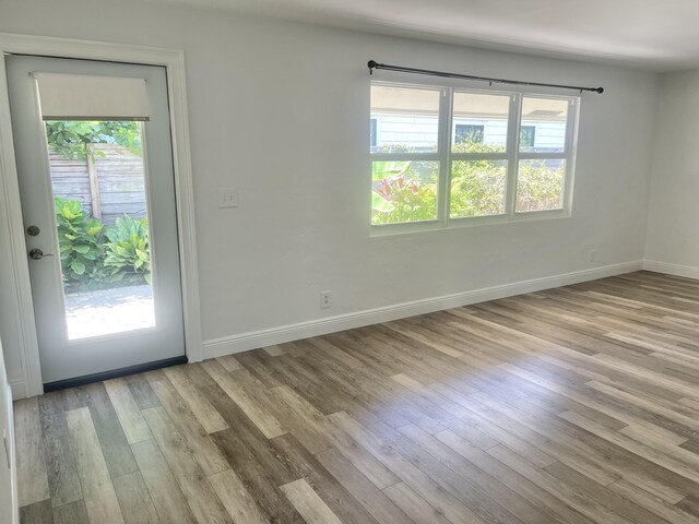 unfurnished room featuring light hardwood / wood-style floors