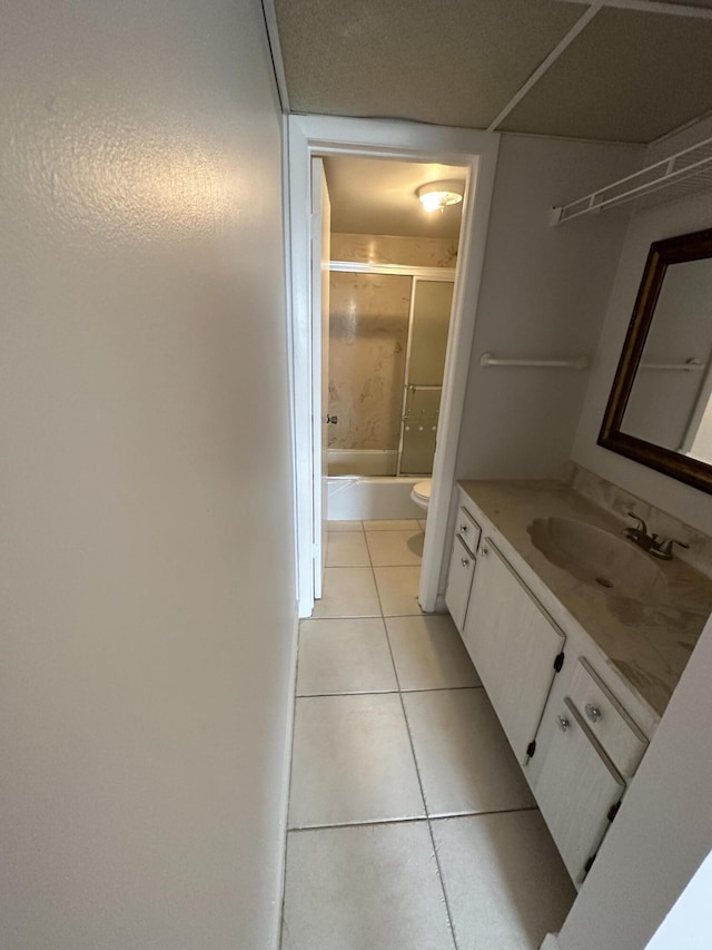 full bathroom featuring tile patterned flooring, vanity, shower / bath combination, and toilet