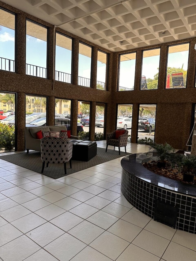 sunroom / solarium featuring coffered ceiling