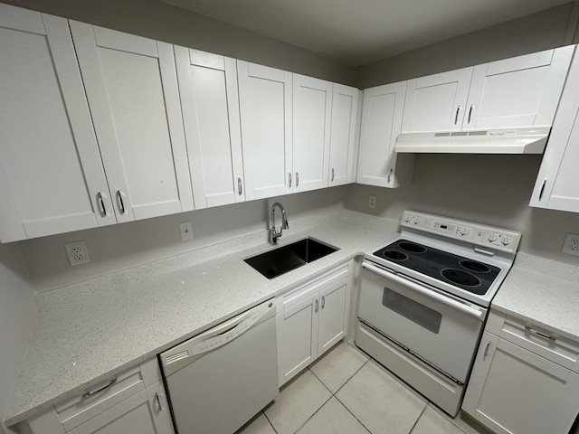 kitchen with white cabinetry, white appliances, sink, and light tile patterned floors