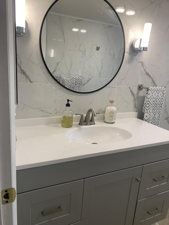 bathroom with vanity and backsplash