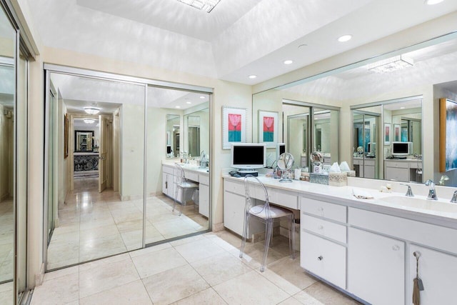 bathroom with tile patterned floors and vanity