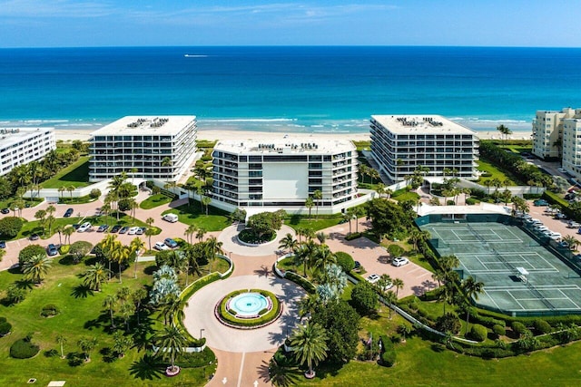 drone / aerial view with a beach view and a water view