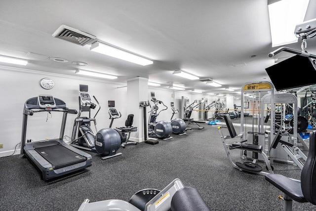 exercise room with a textured ceiling