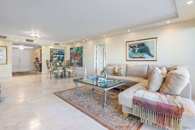 living room featuring a tray ceiling