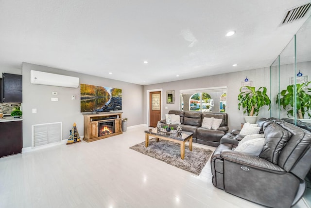 living room with a wall mounted air conditioner