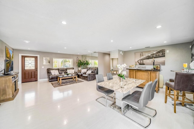 dining space with a textured ceiling