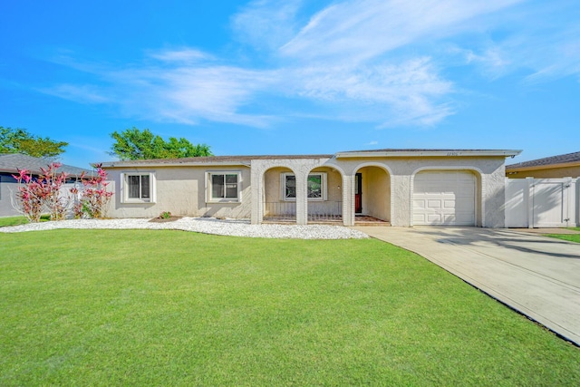 ranch-style house with a front yard and a garage