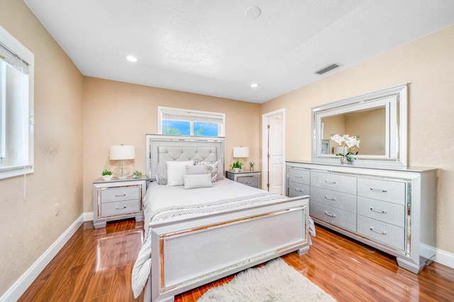 bedroom featuring wood-type flooring