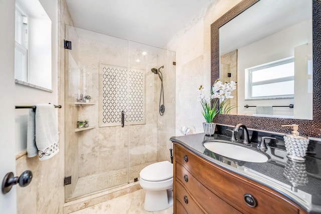 bathroom with vanity, toilet, tile walls, and an enclosed shower